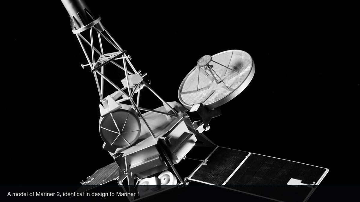 A model of the Mariner 2 spacecraft, identical in design to Mariner 1, photographed against a black background. Captioned as such in the image.