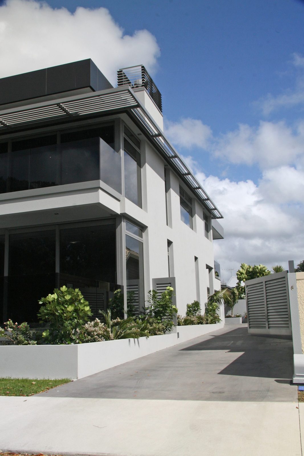 Water View Homes — side wall and planter
