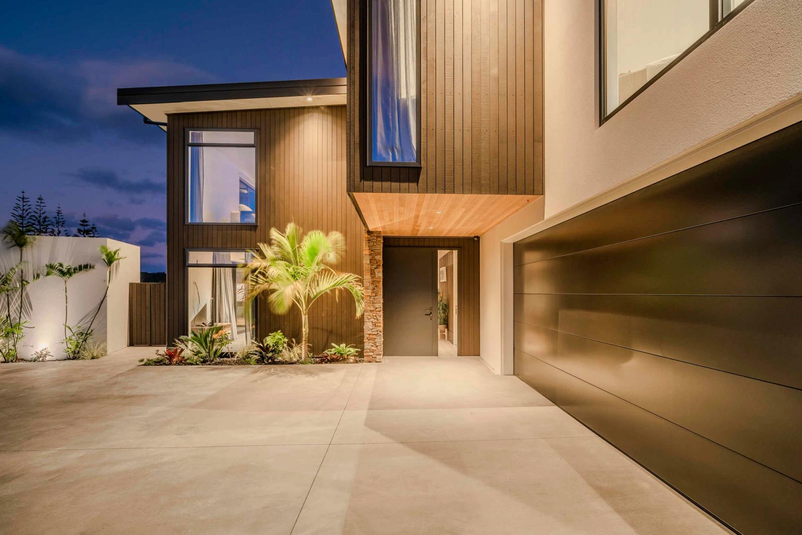 Cedar and stone entry at dusk