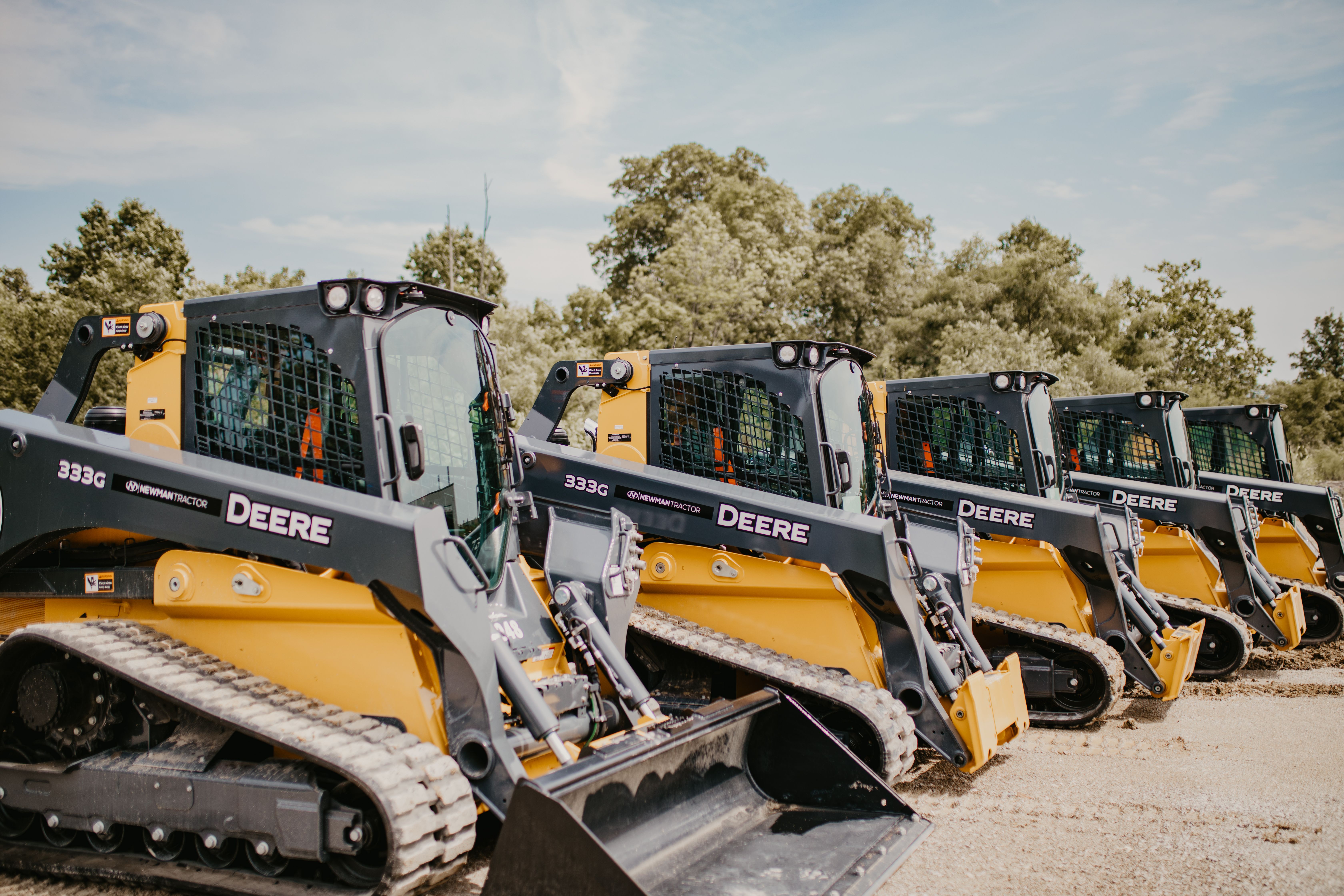 Deere skidsteers lined up