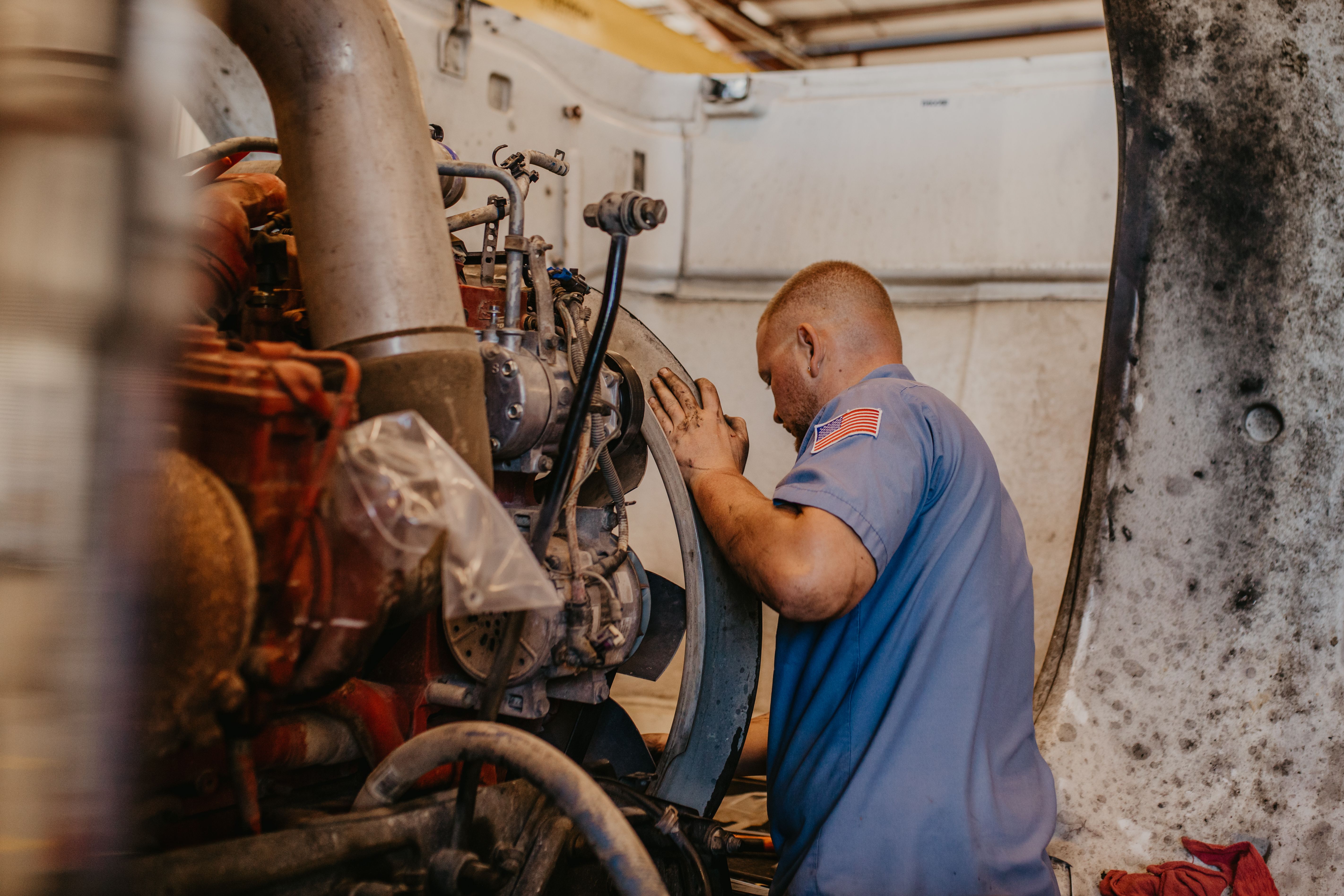 a technician working on a truck