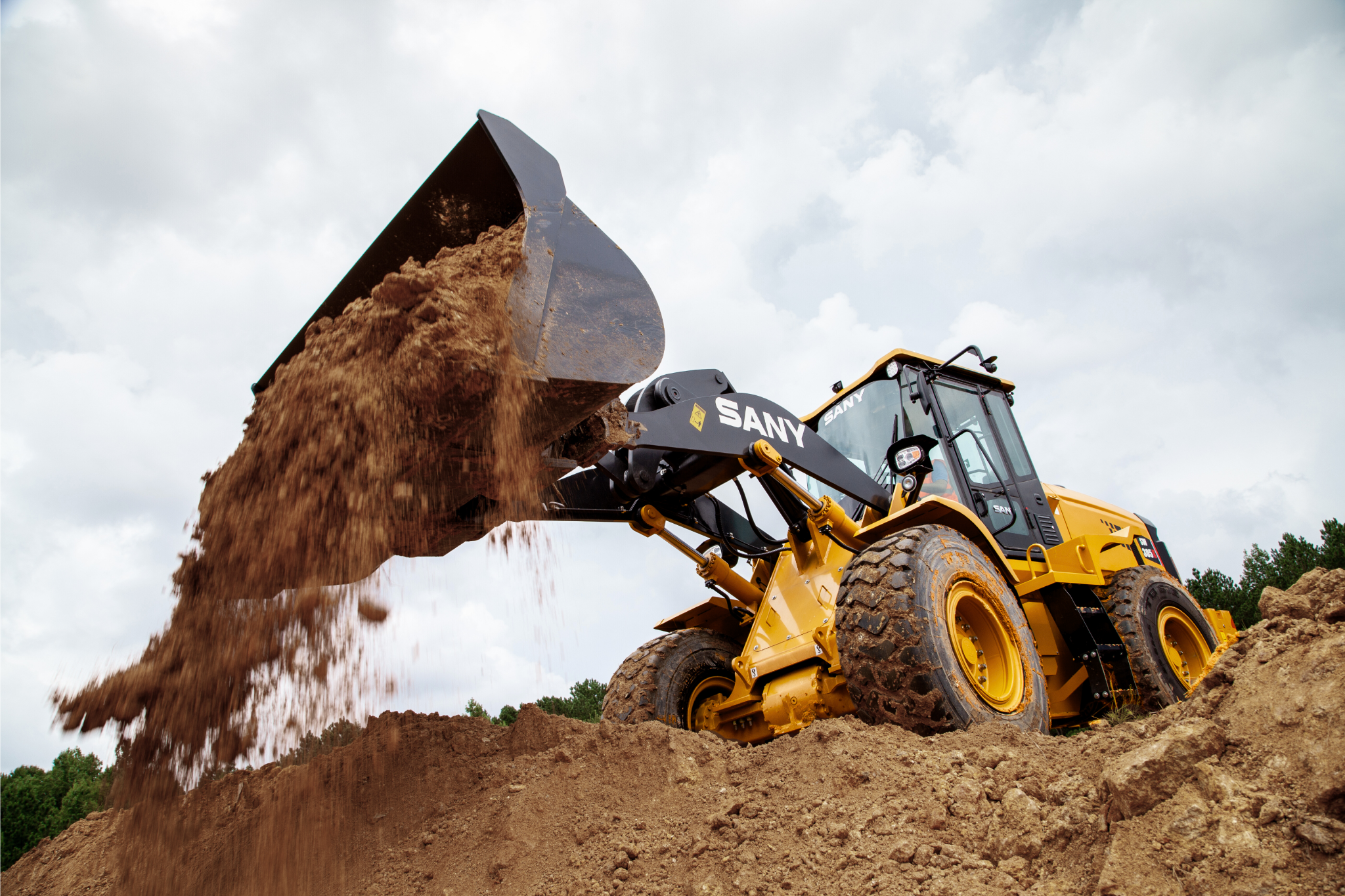 sw305k-wheel-loader-dumps-bucket-of-dirt