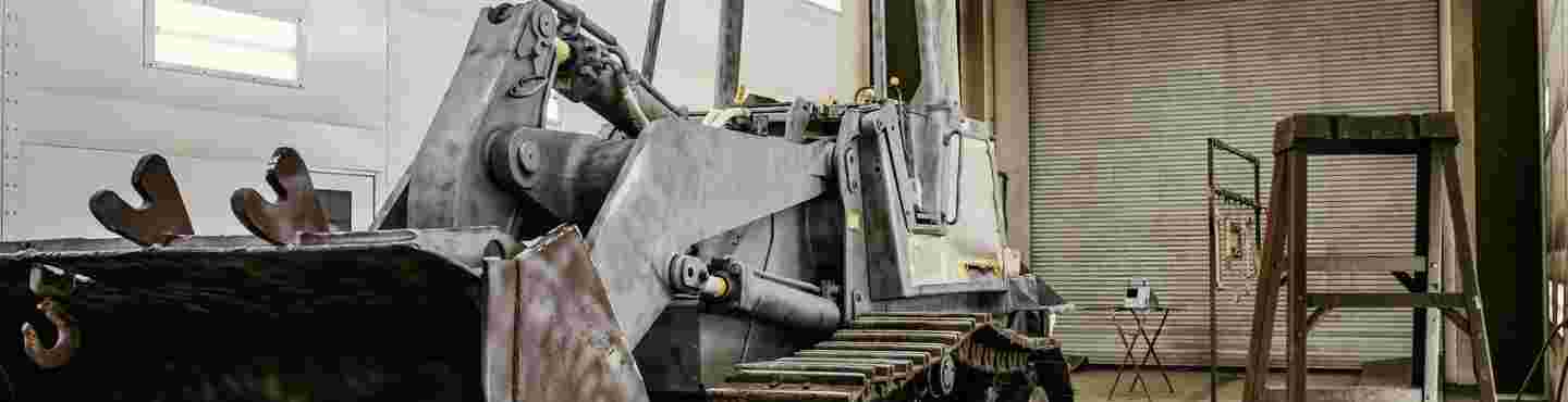 heavy equipment repair man drilling