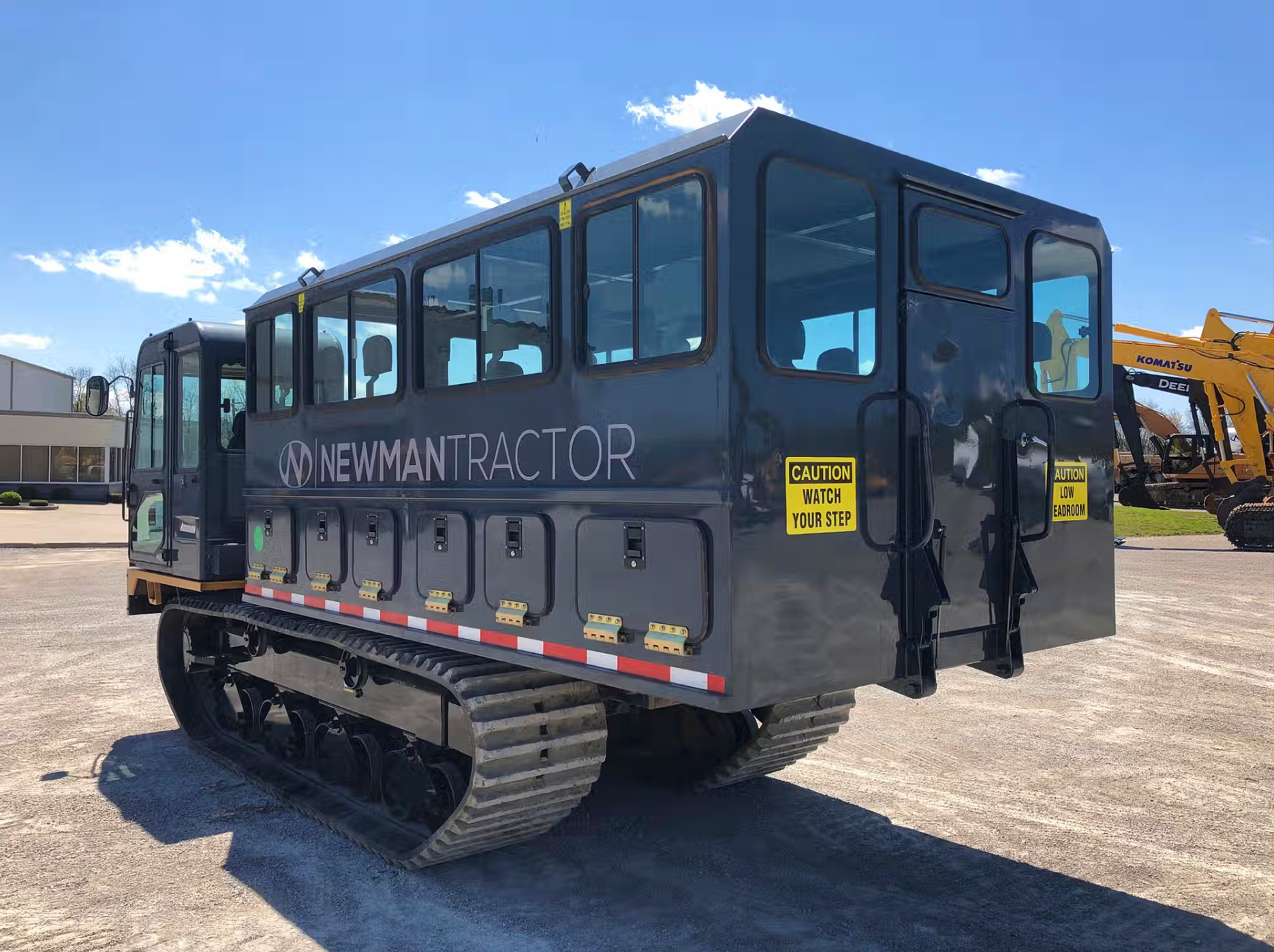 Morooka tracked dump truck with a personnel carrier