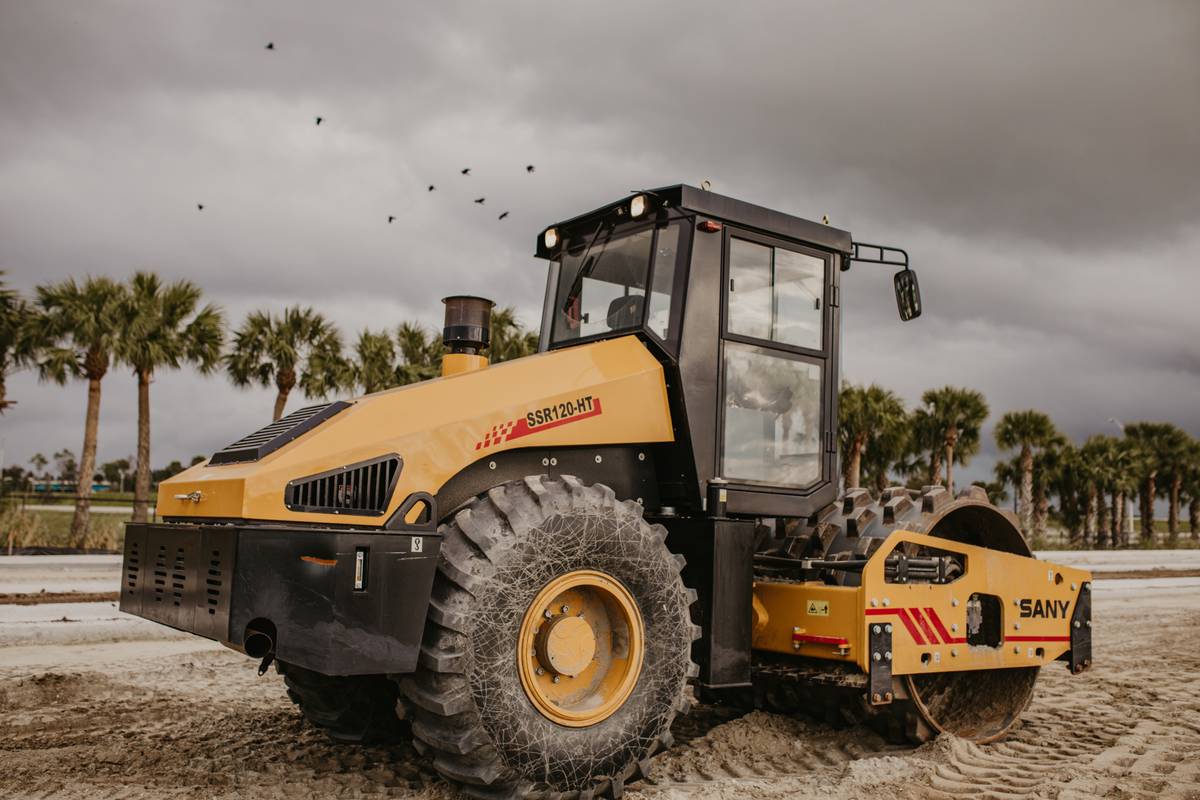 SANY roller with palm trees in the background