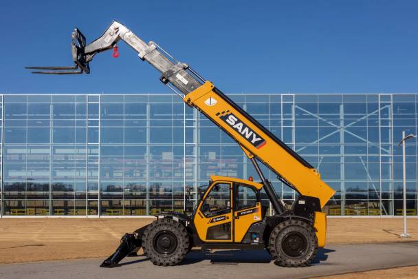 SANY telehandler in front of a building