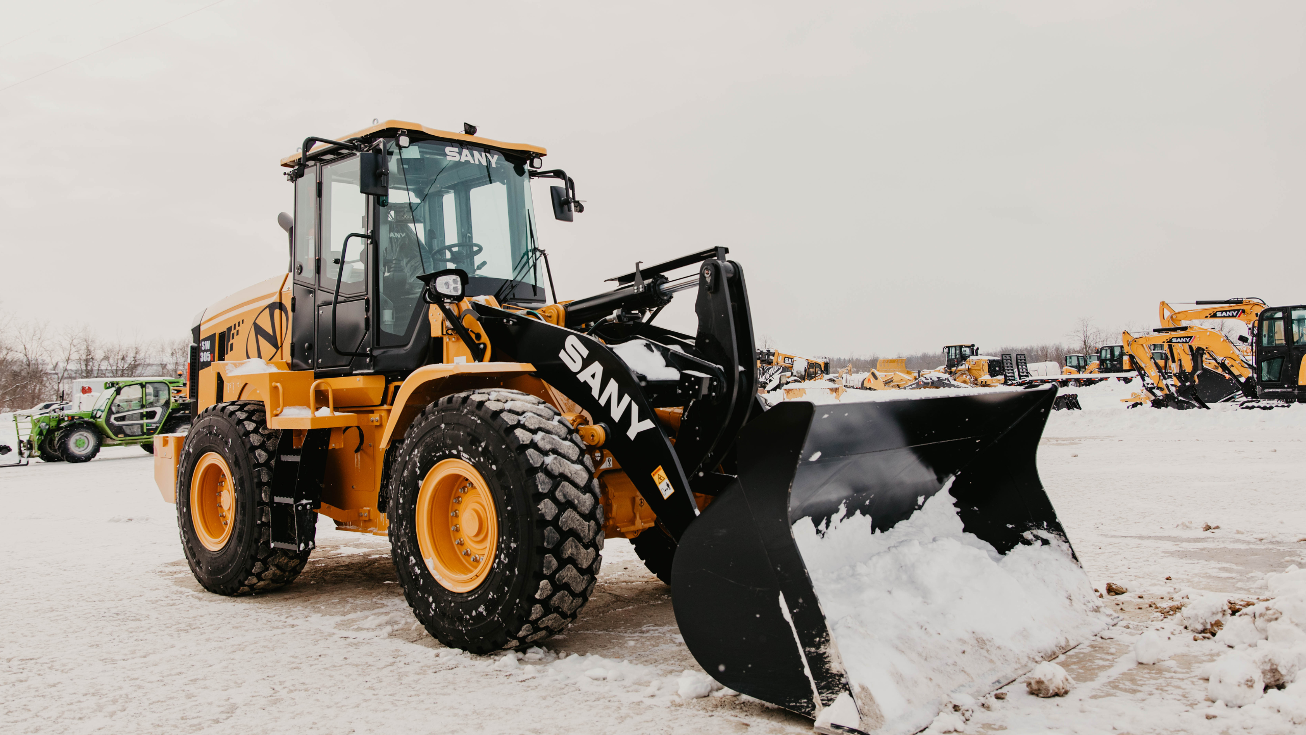 loader plowing in snow