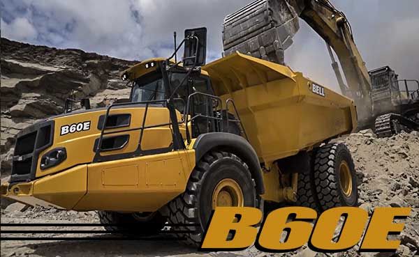 Bell B60E on a job site being loaded by an excavator