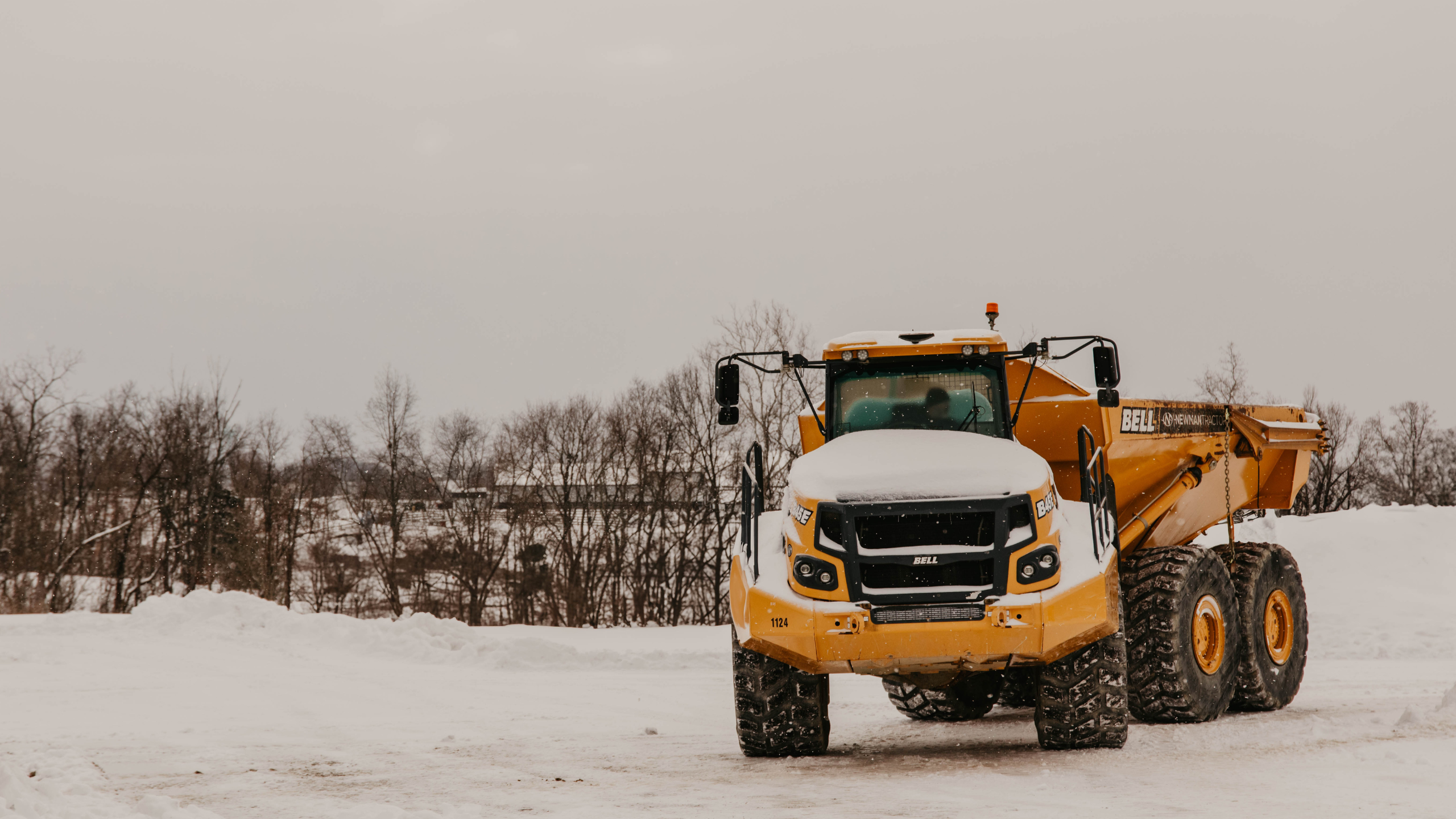 articulated dump truck in the snow