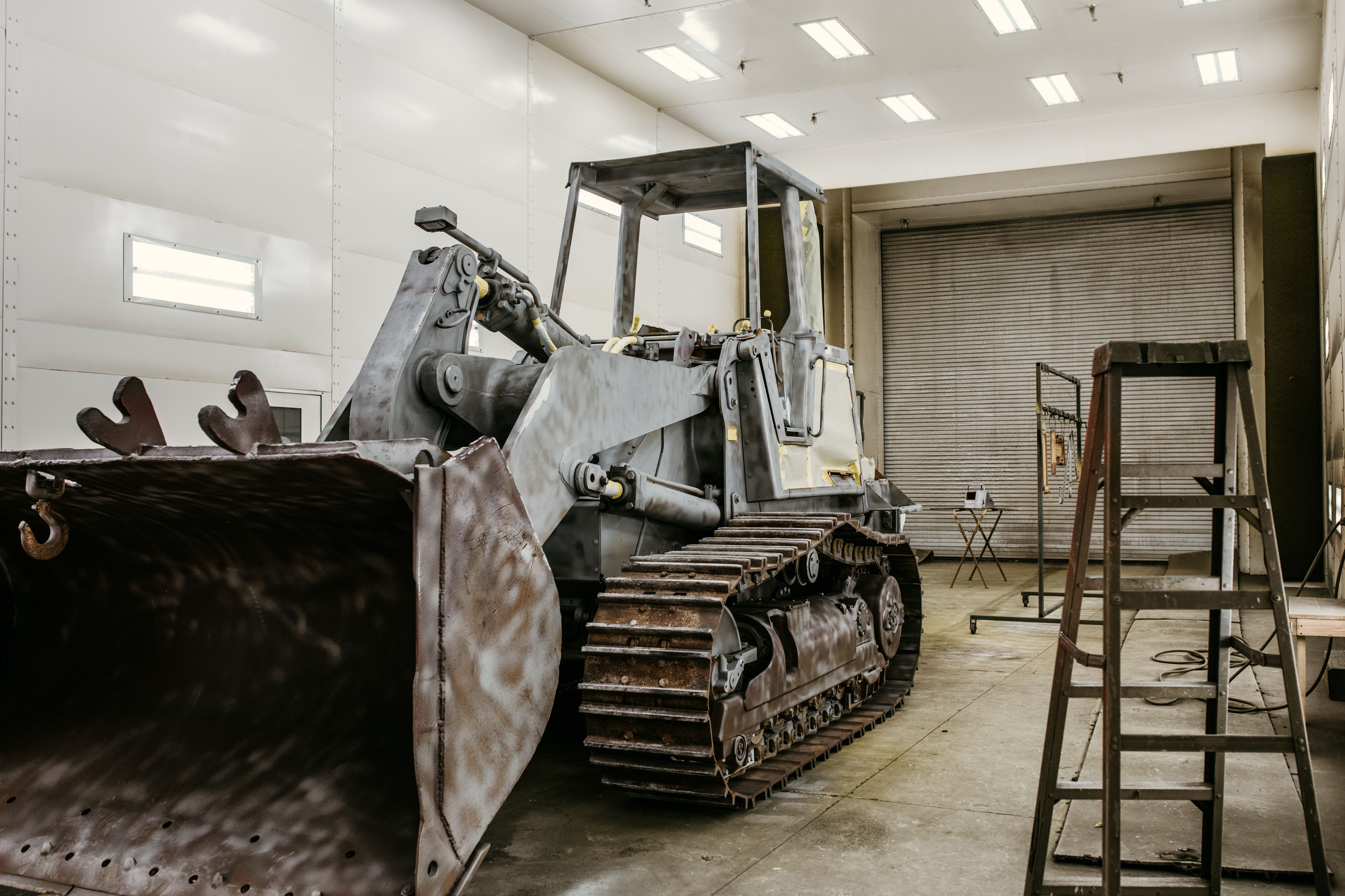 heavy equipment repair man drilling