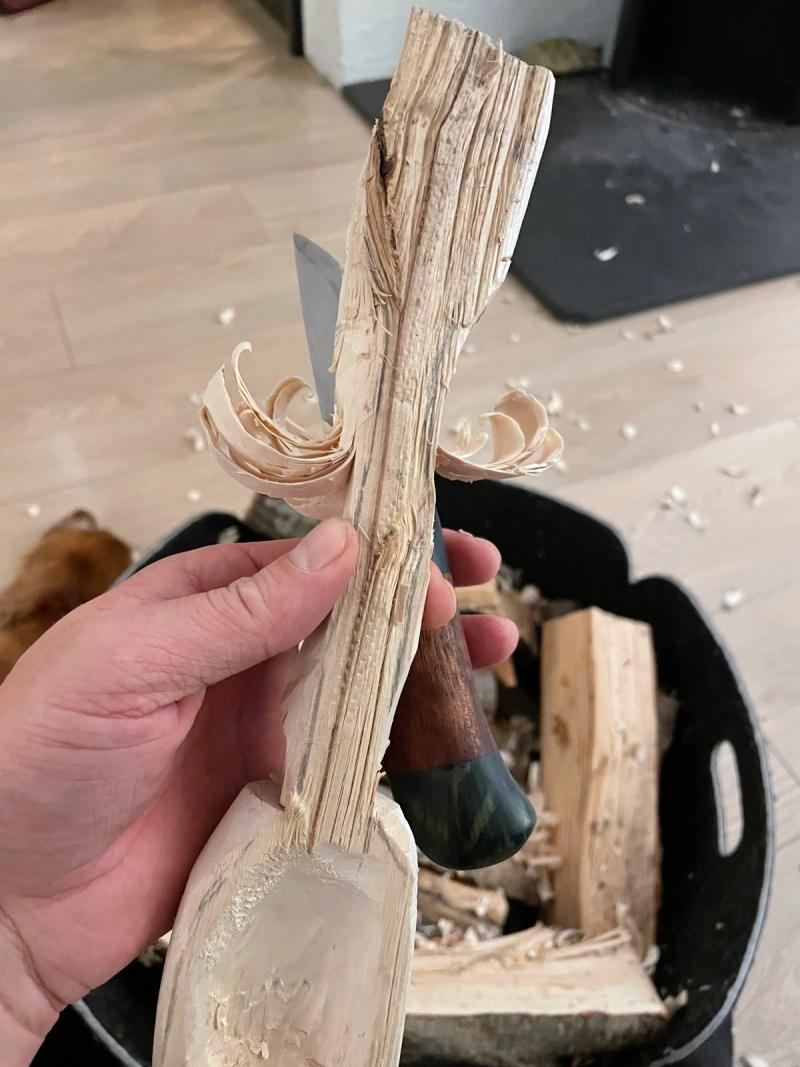 a wooden spoon beeing carved out