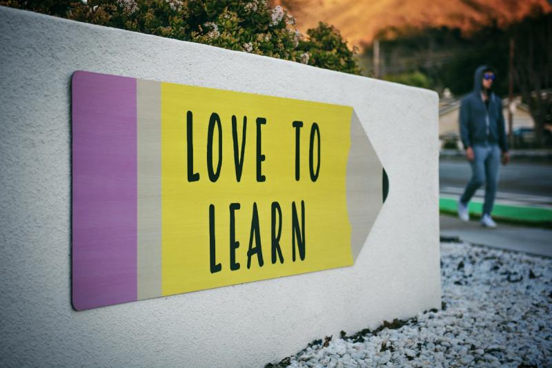 sign that says love to learn