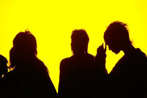 black silhouettes on yellow background 