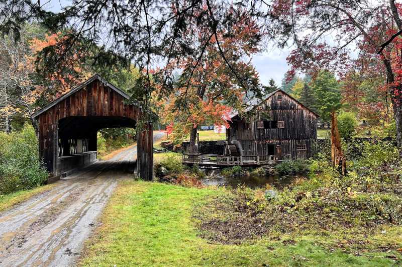 View of the covered bridge with Leonard's Mill across the river. 