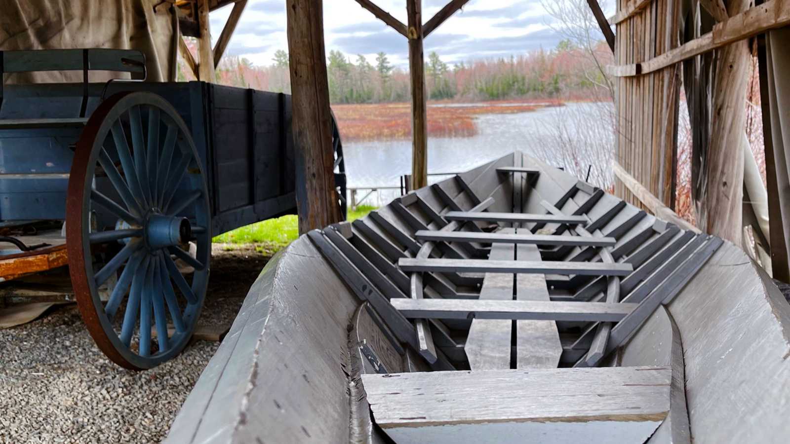 Museum's Batteau boat on the shore of the Blackman Stream.