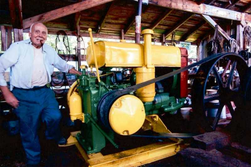 Bill Donnell seen with his 1939 John Deere make-and-break engine