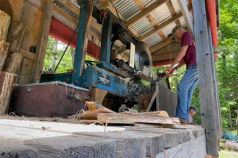 Volunteer working the shingle mill