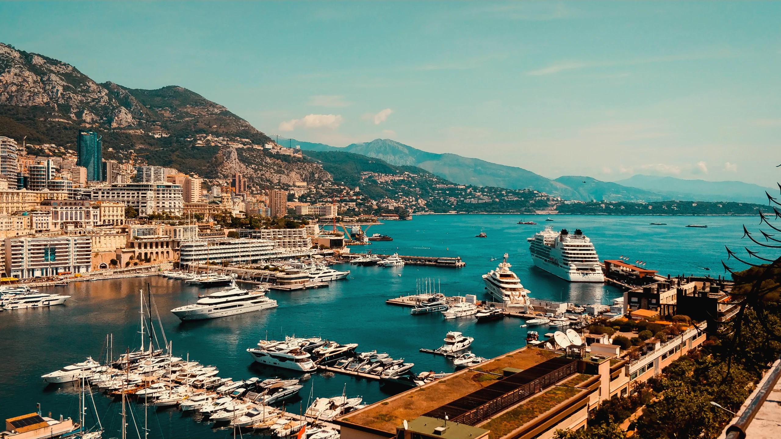Monaco cliff buildings and Mediterranean coastline in bright daylight