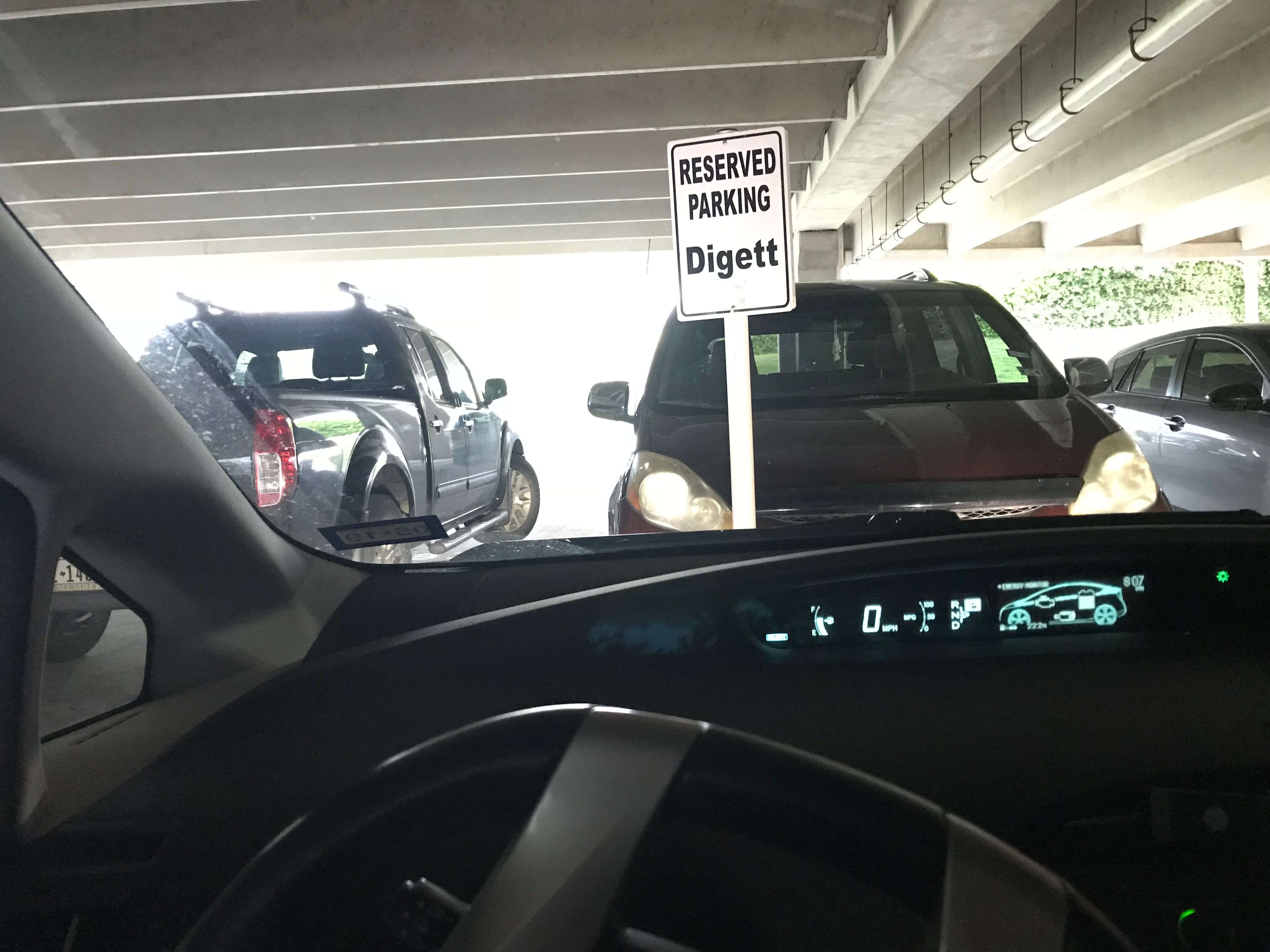 Reserved parking sign for Digett in a parking garage