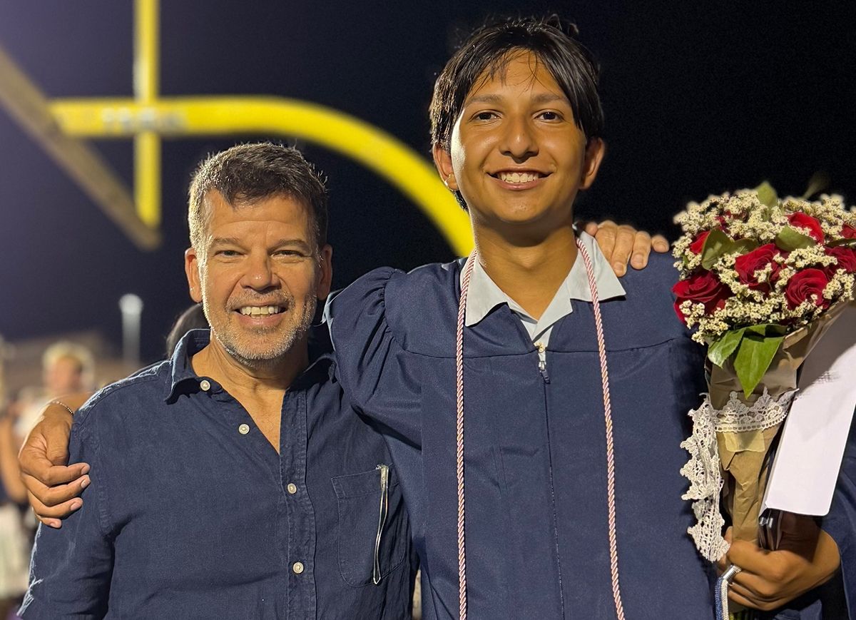 Mark Figart with son on his graduation day