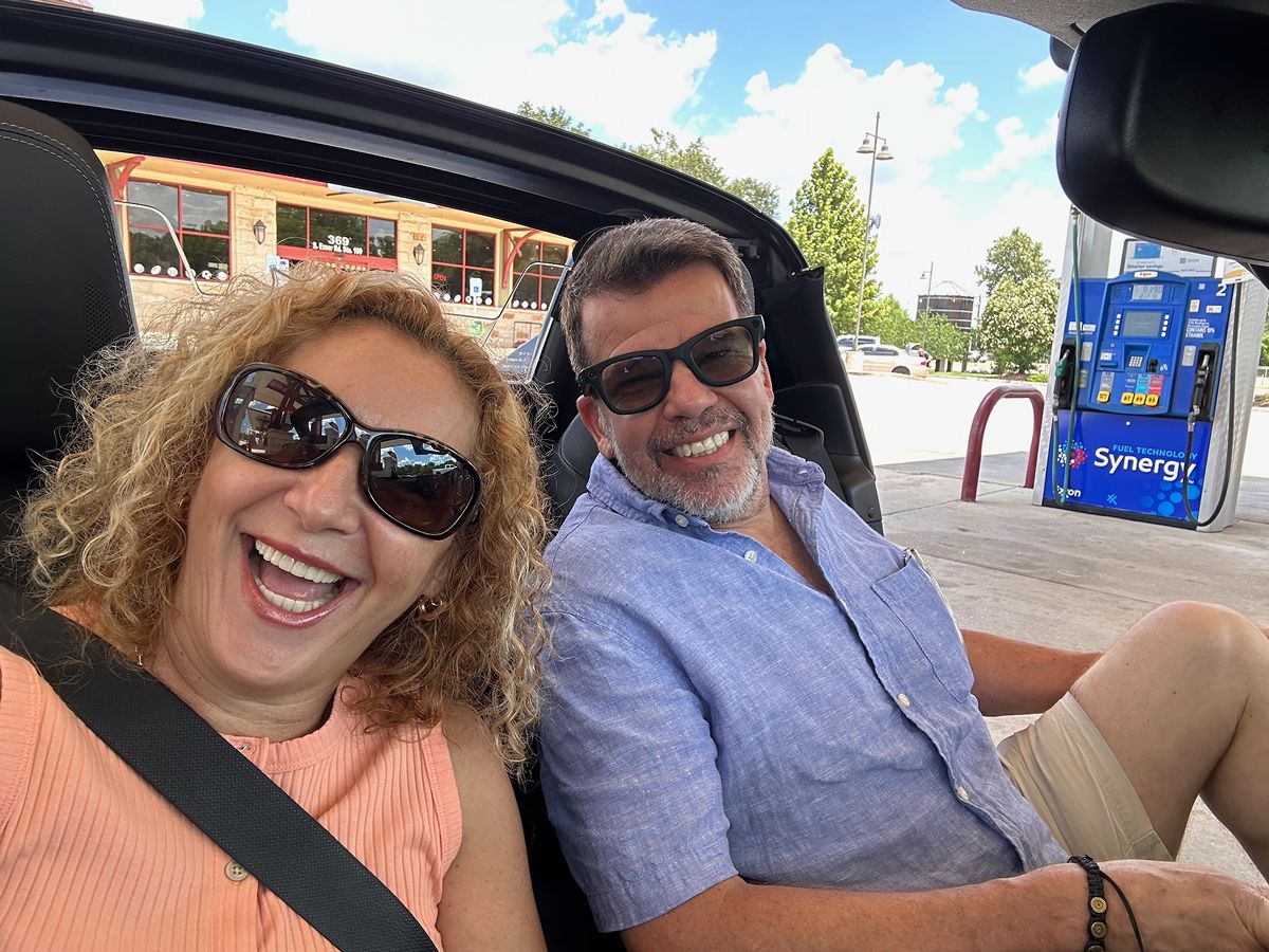 Mark Figart with wife, Claudia, in the Miata