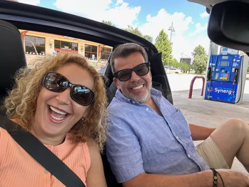 Mark Figart with wife, Claudia, in the Miata