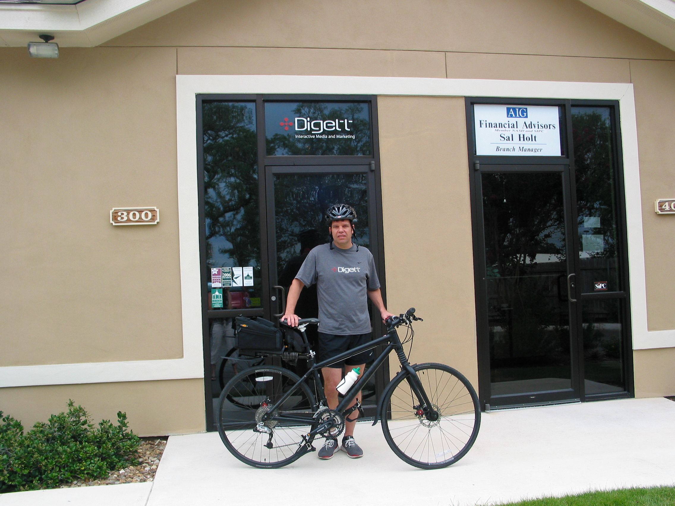 Mark Figart with bicycle outside the original Digett office