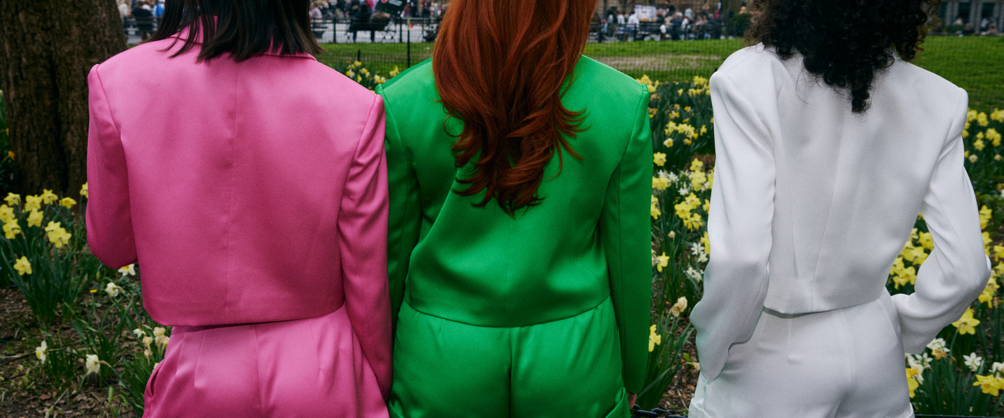 women in matching satin blazer set