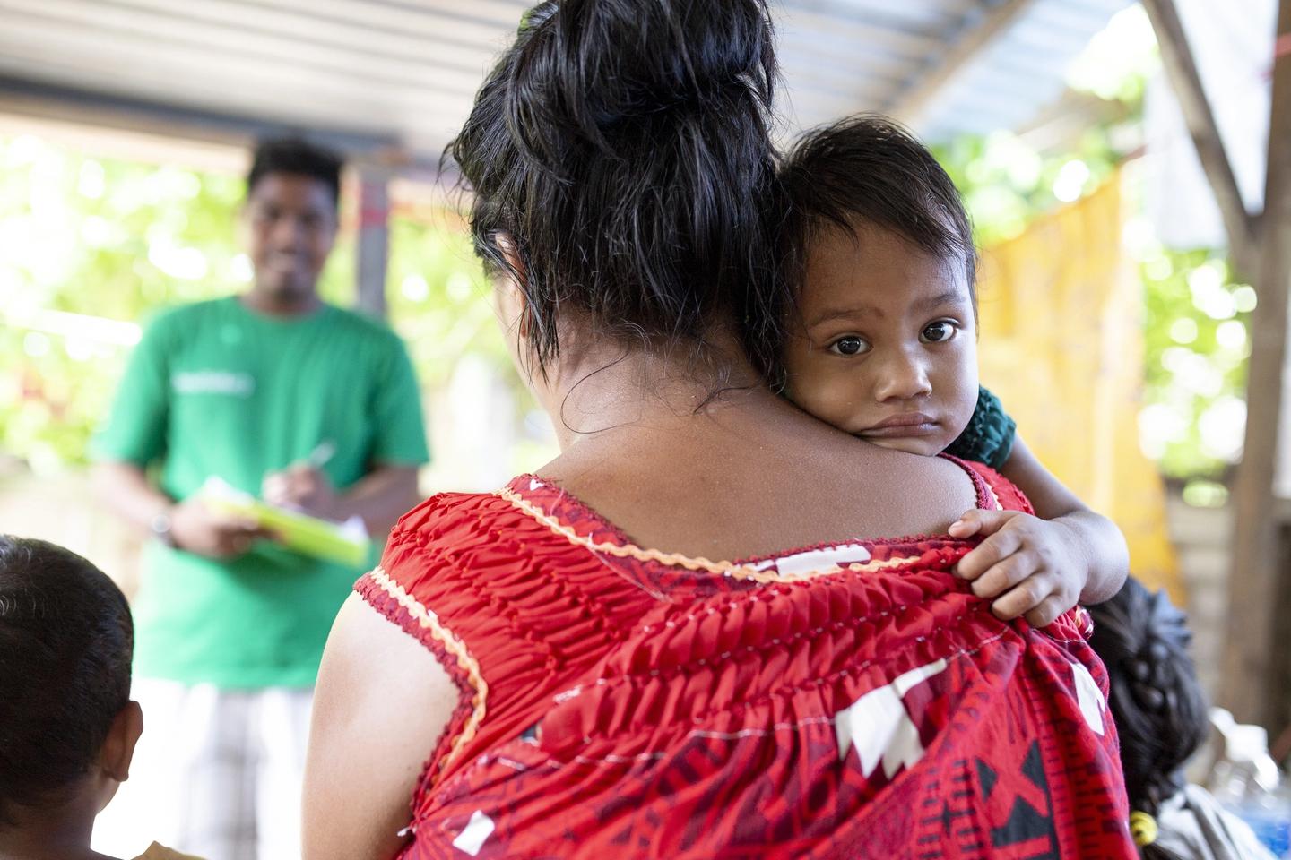 Child and parent in Kiribati