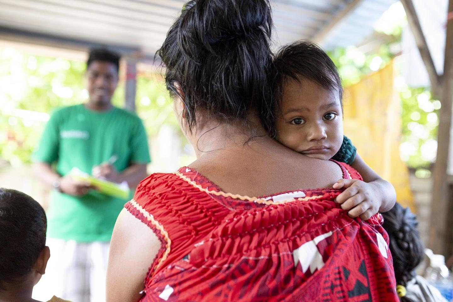 Child and parent in Kiribati