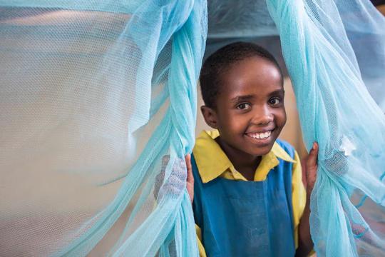 child with mosquito net