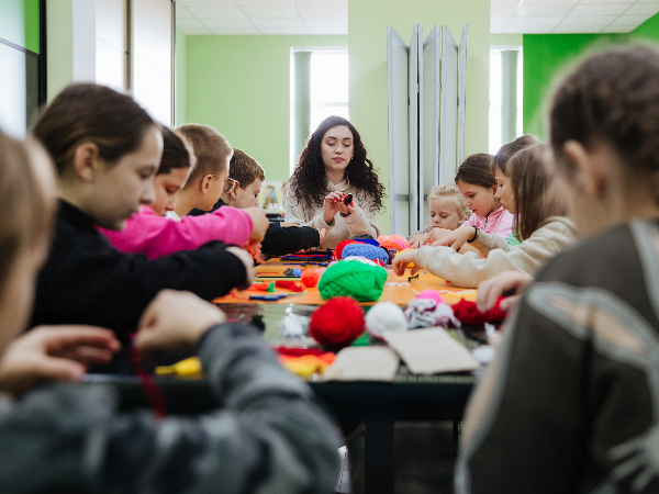 Ukrainian refugee children doing arts and crafts in Moldova