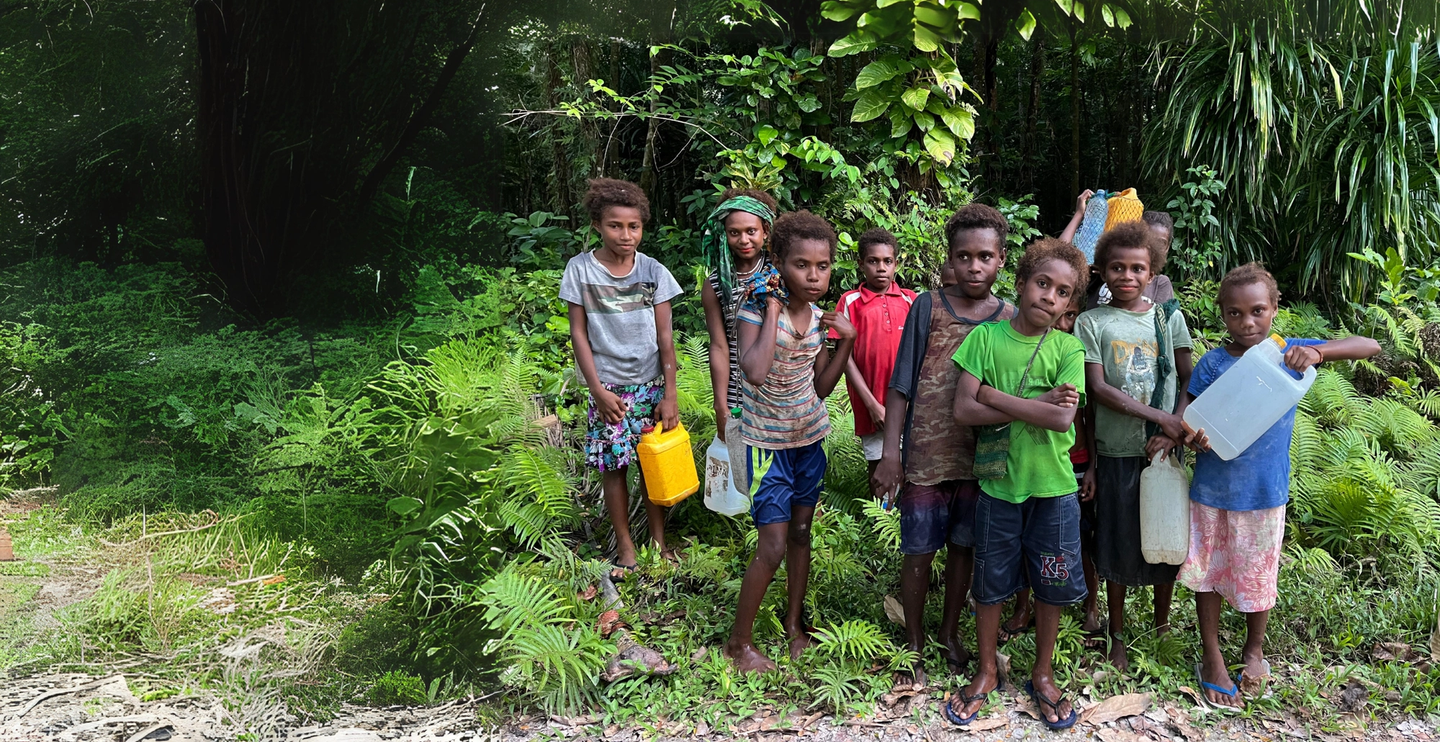 boys walking for water