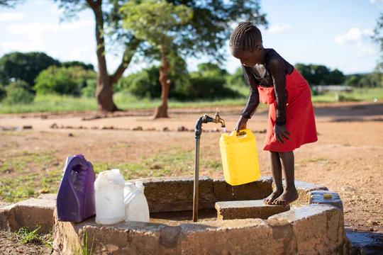 Child using water well