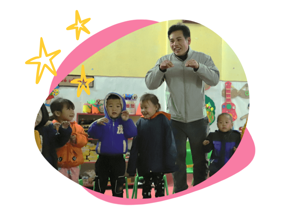 father teaching children in preschool
