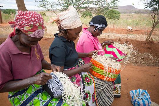 women weaving baskets