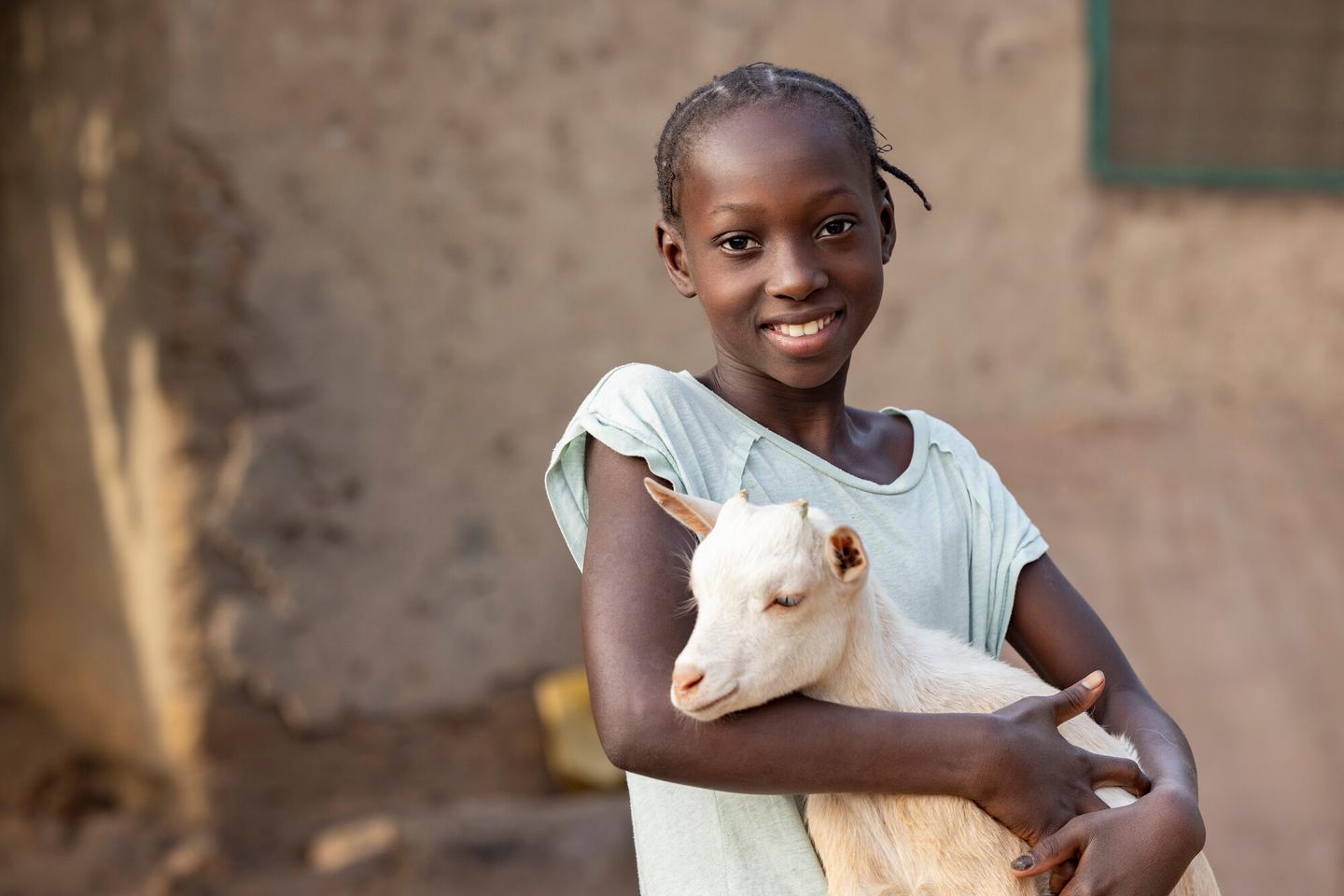 child holding goat
