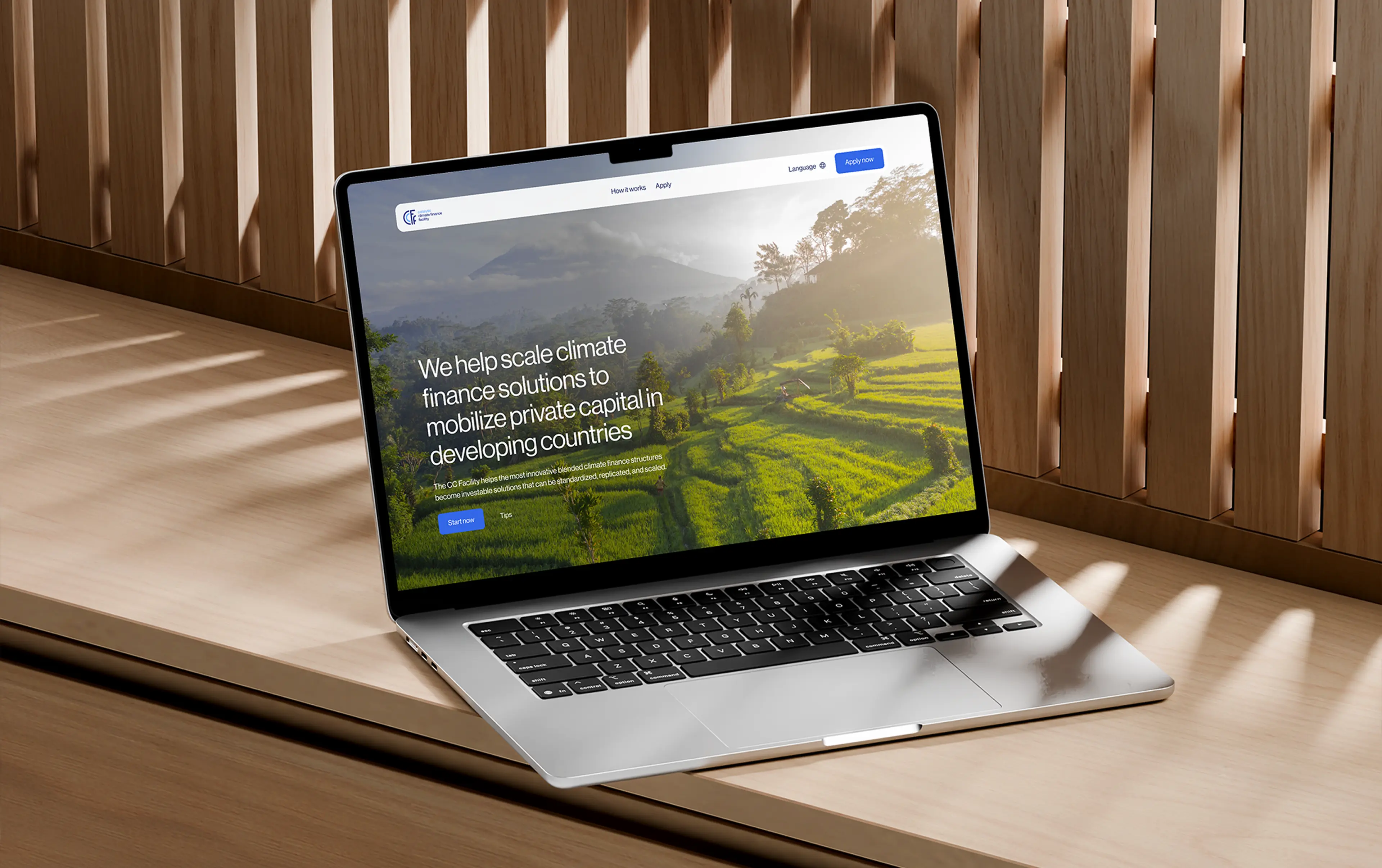 a preview image of the CC Facility website shown on a laptop in a modern environment