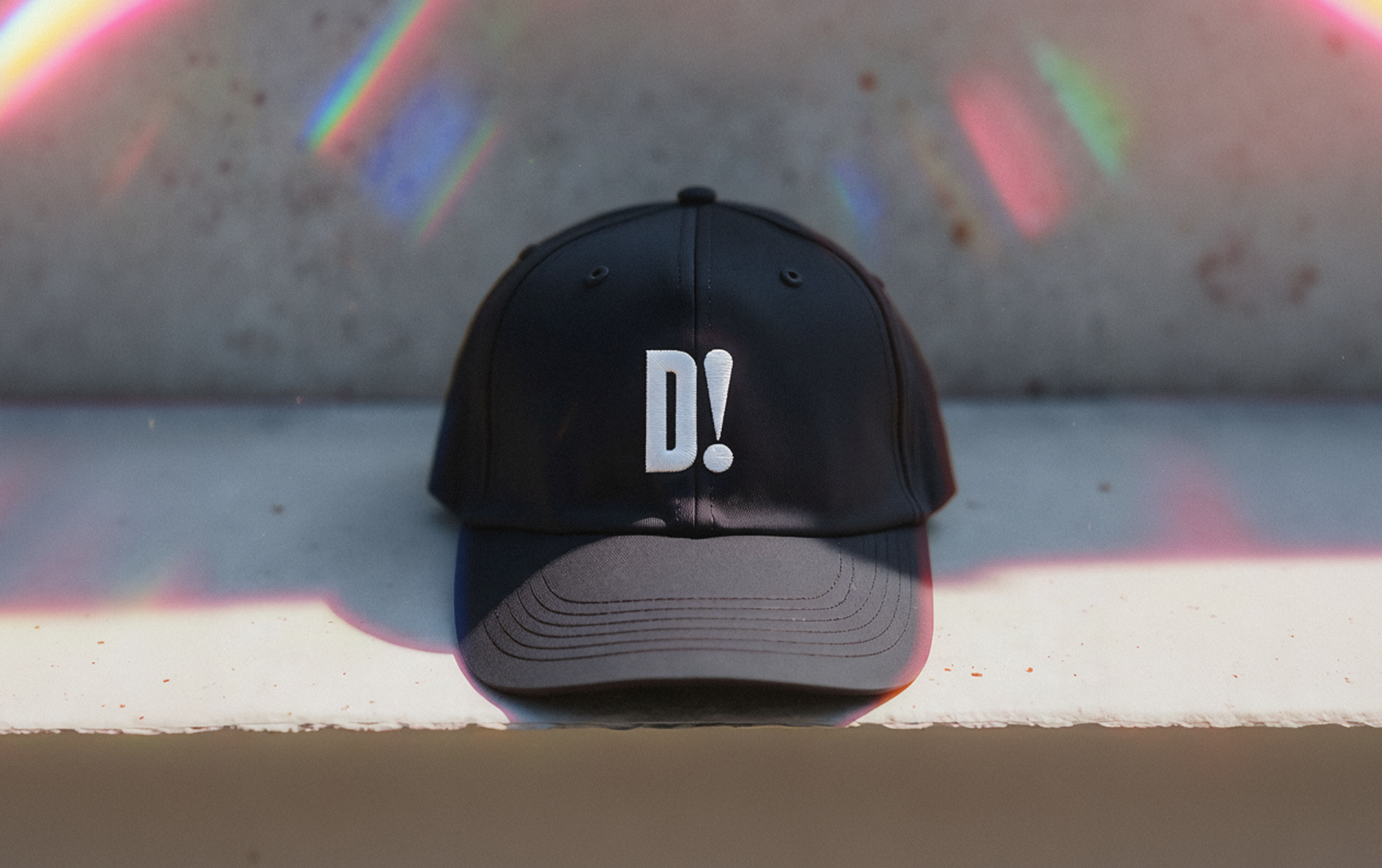 D! cap on a concrete bench