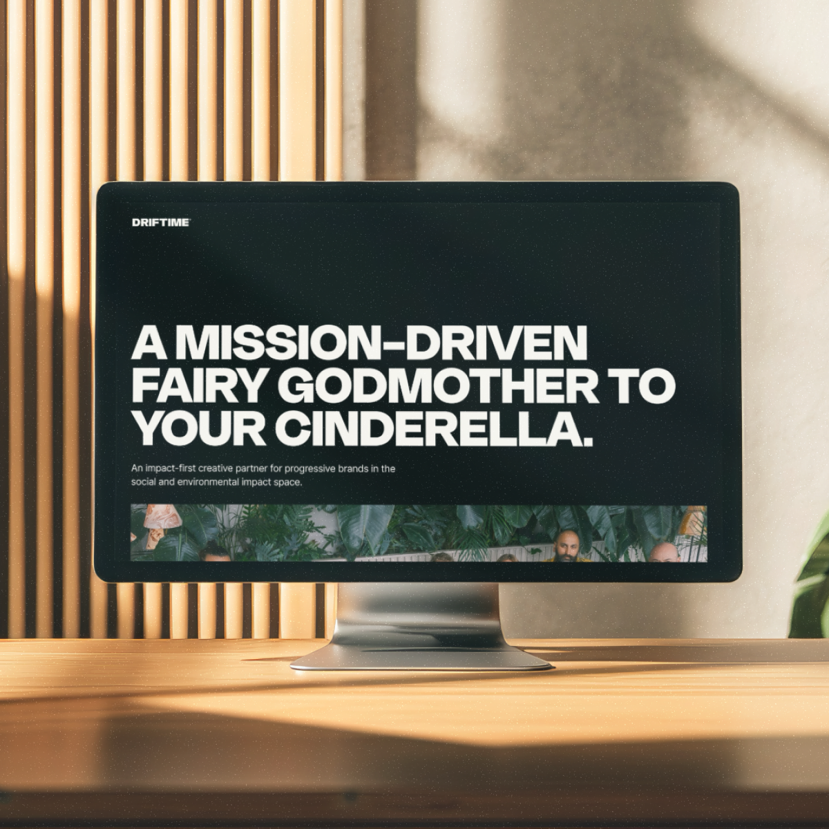 A monitor on a desk displaying the new Driftime website