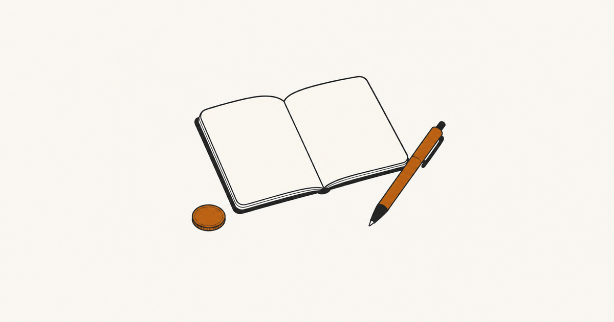 Open notebook beside an orange pen and a coin.