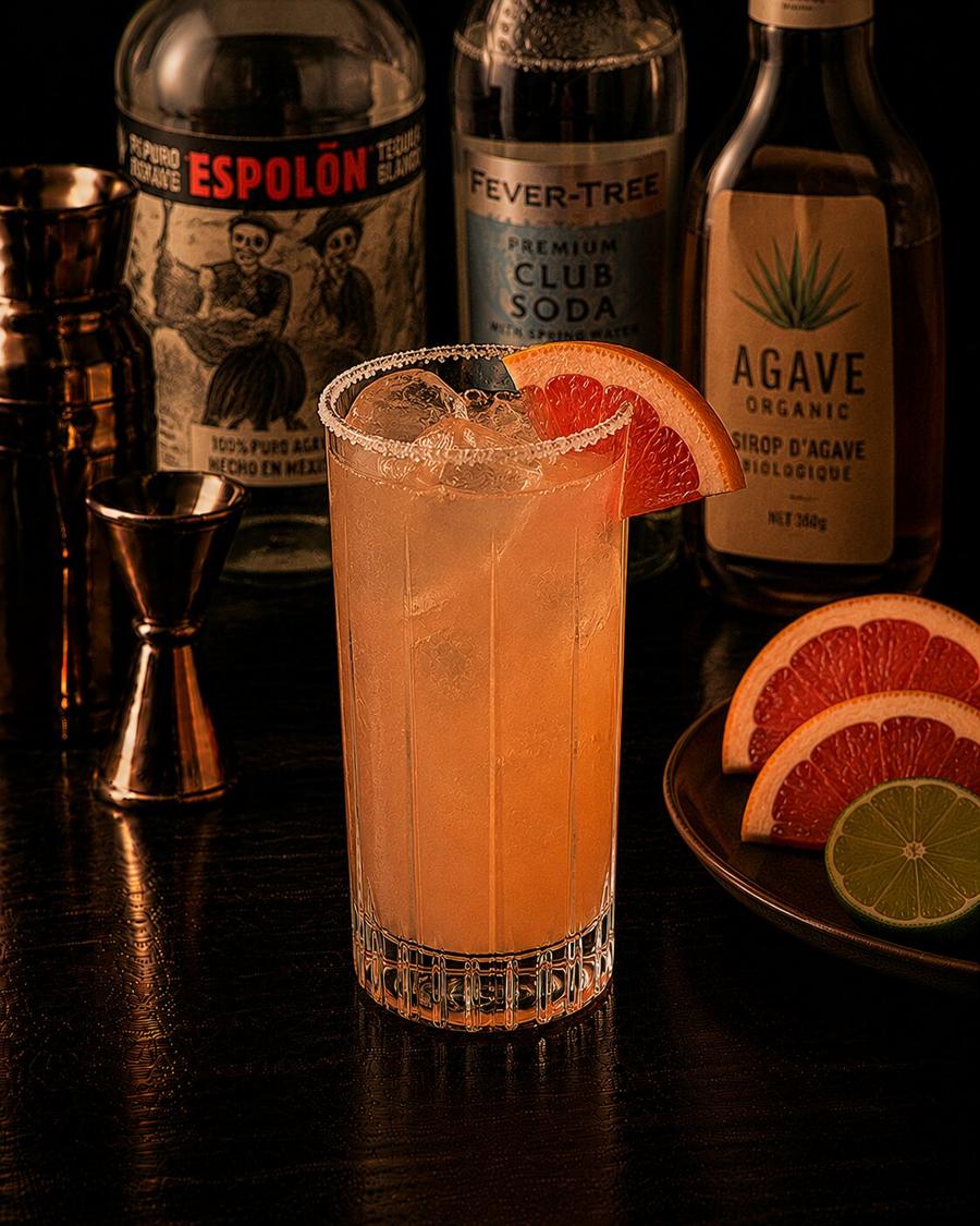 Paloma drink with grapefriut wedge and salted rim