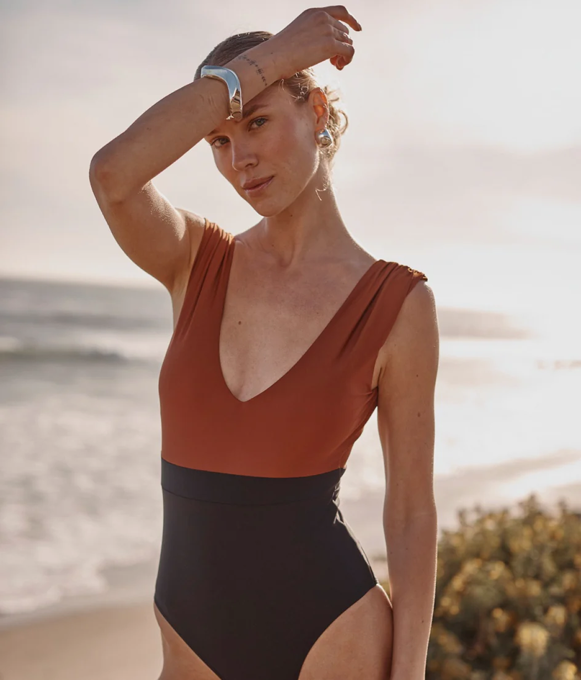 Best Sellers. Model in brown and black one piece. 