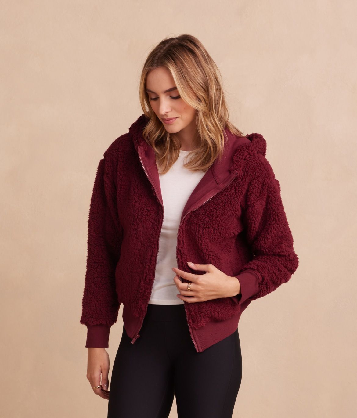 Model in Fleece & leggings, The High Pile Eco Fleece Cropped Hoodie & The Brushed Leggings - Pinot (Burgundy Red)