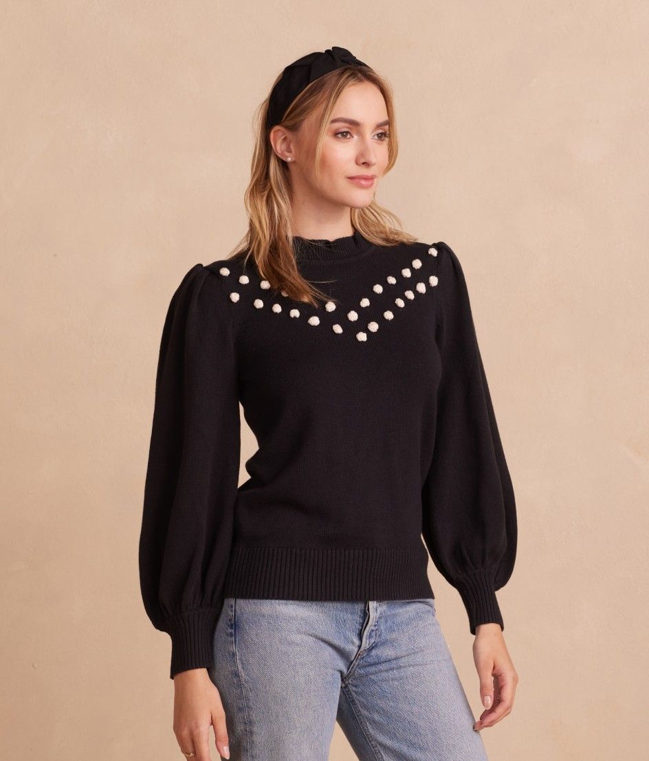 Model in sweater, The Year-Round Balloon Pompom Sweater - Sea Urchin (black)