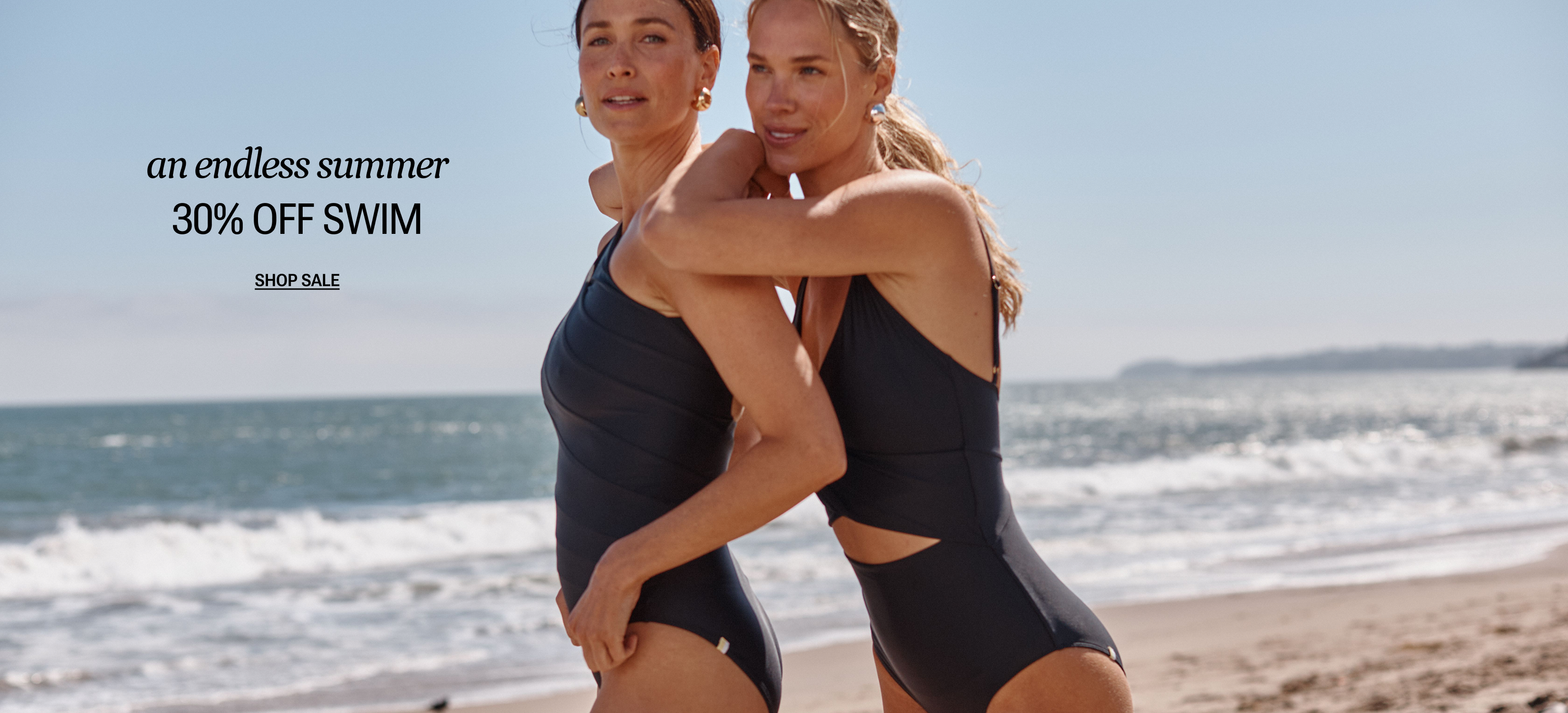 Models in one piece swimsuits and seersucker cover-up set