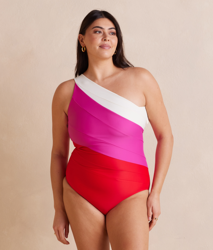 Model in one piece swimsuit, The Sidestroke - Lava & Hibiscus & White Sand