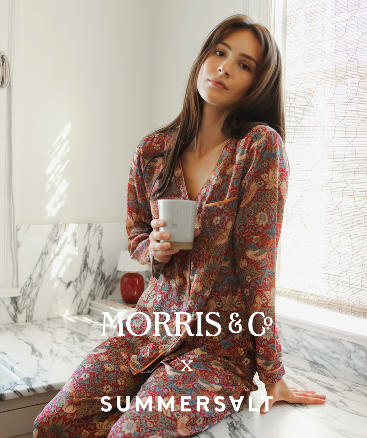 Morris & Co. x Summersalt Model in The Silky Luxe Pajama Set in Strawberry Thief in Crimson & Slate (red pattern)