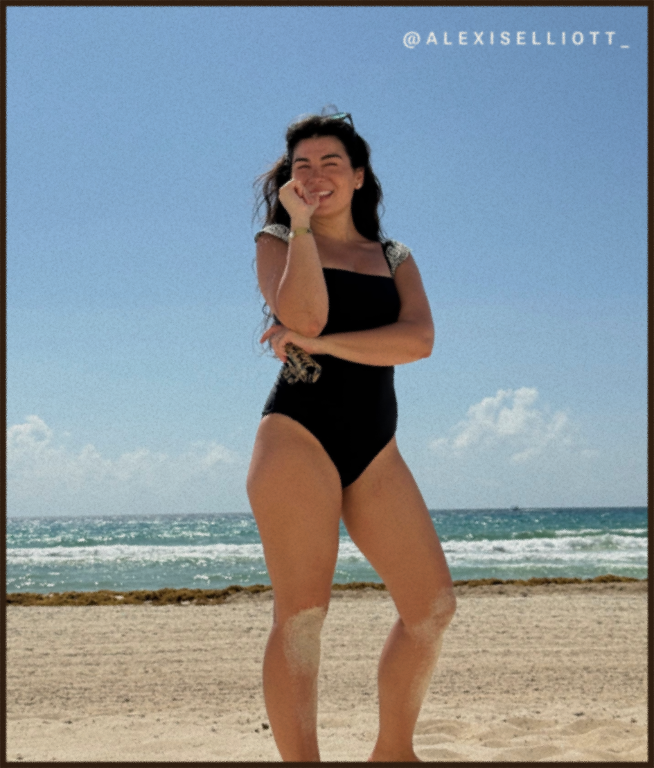 Model in black one piece swimsuit