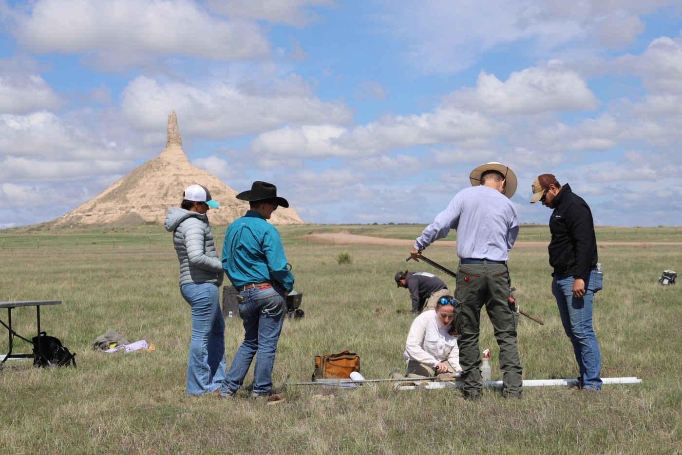 A Nebraska soil health research team collecting reference-site samples in native grassland near Chimney Rock.